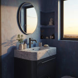This wall-mounted vanity features a Carrara marble top and matte black cabinet for a refined modern look.