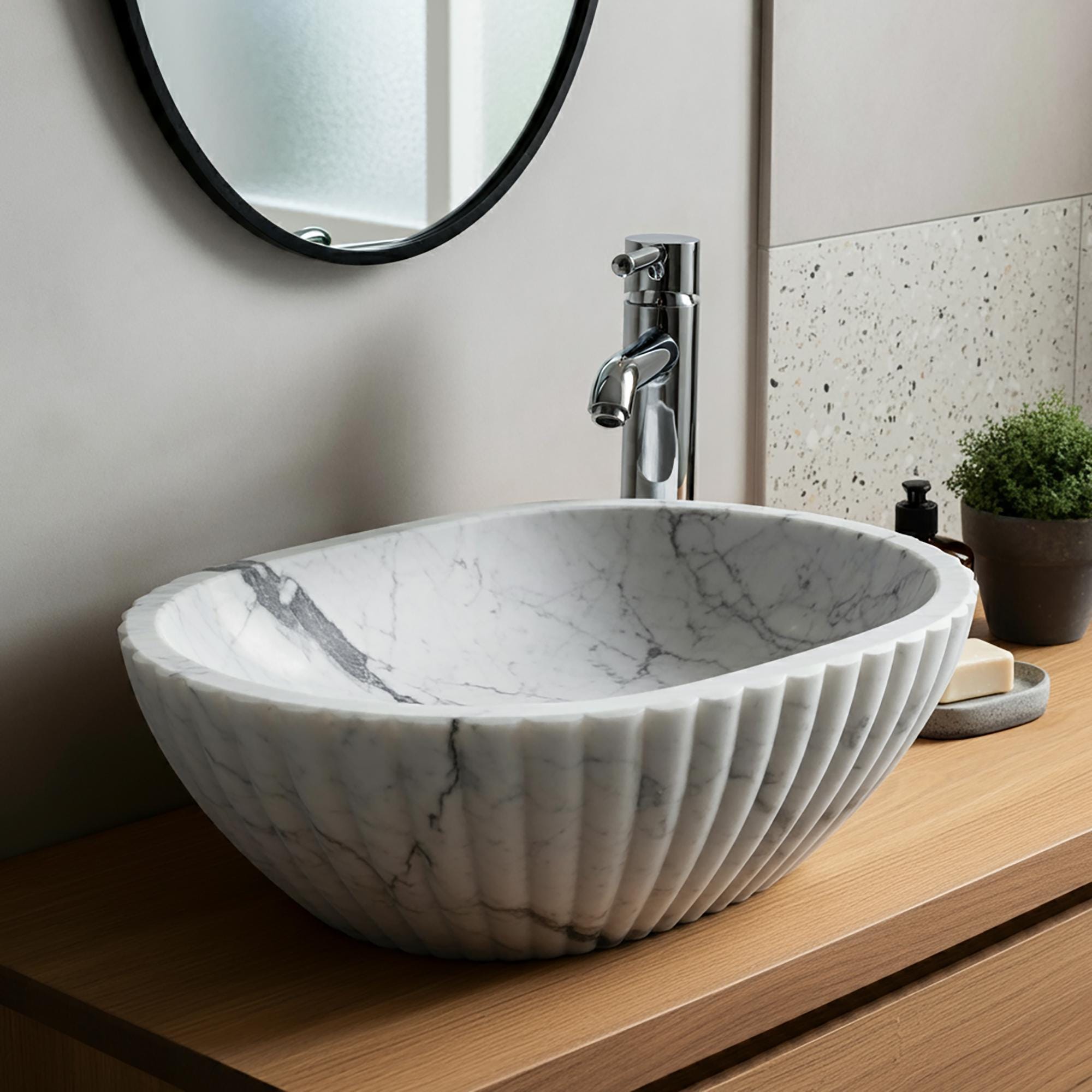Refined bathroom sink with deep bowl, marble veining, and premium craftsmanship.