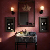 A luxurious fluted black marble sink with wall-mounted design and integrated backsplash.