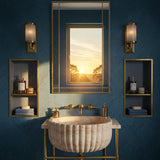 A fluted half-round travertine marble sink is paired with brass accents in a luxury bathroom setting.