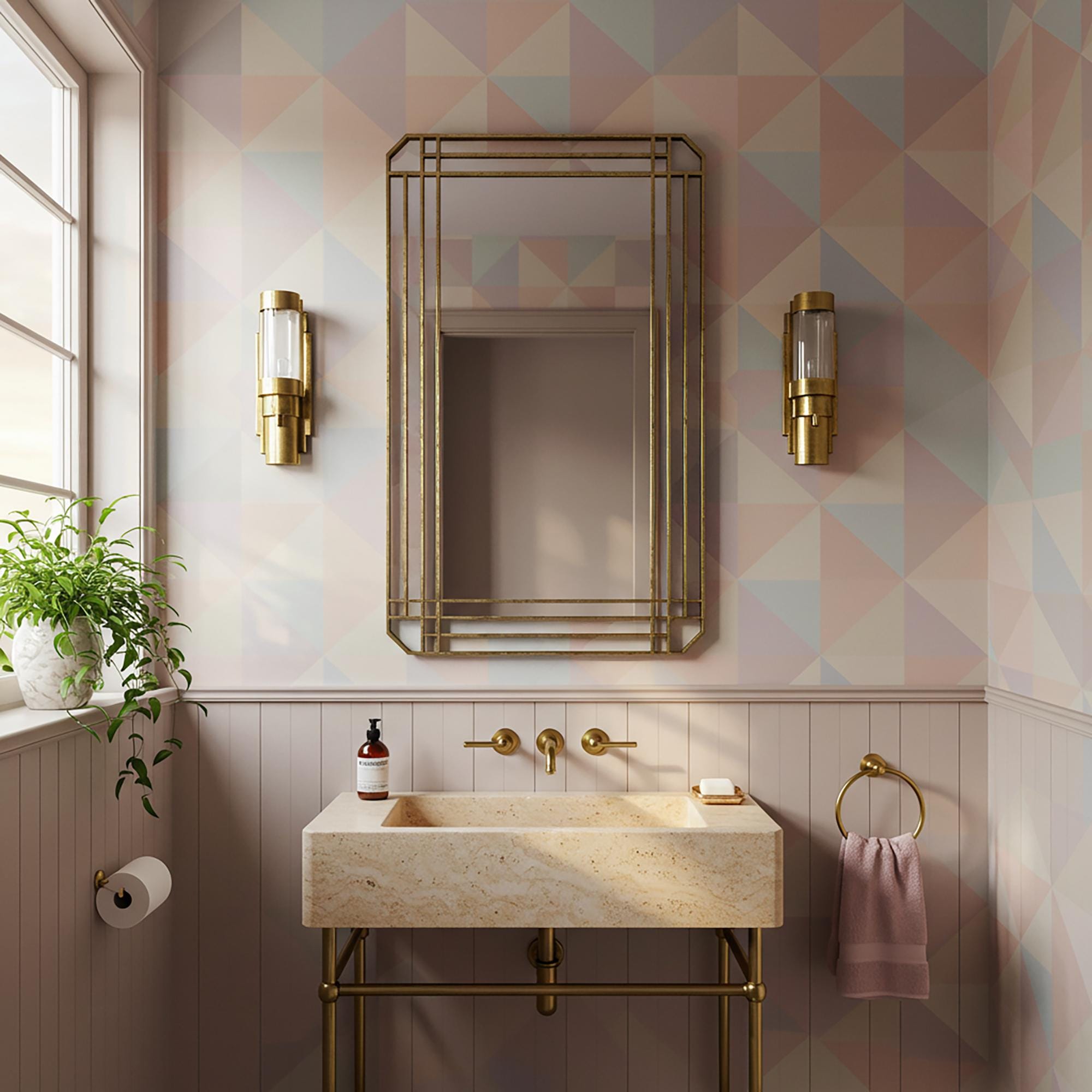 A minimalist travertine sink with brass frame and wall-mounted gold faucet elevates a high-end bathroom space.