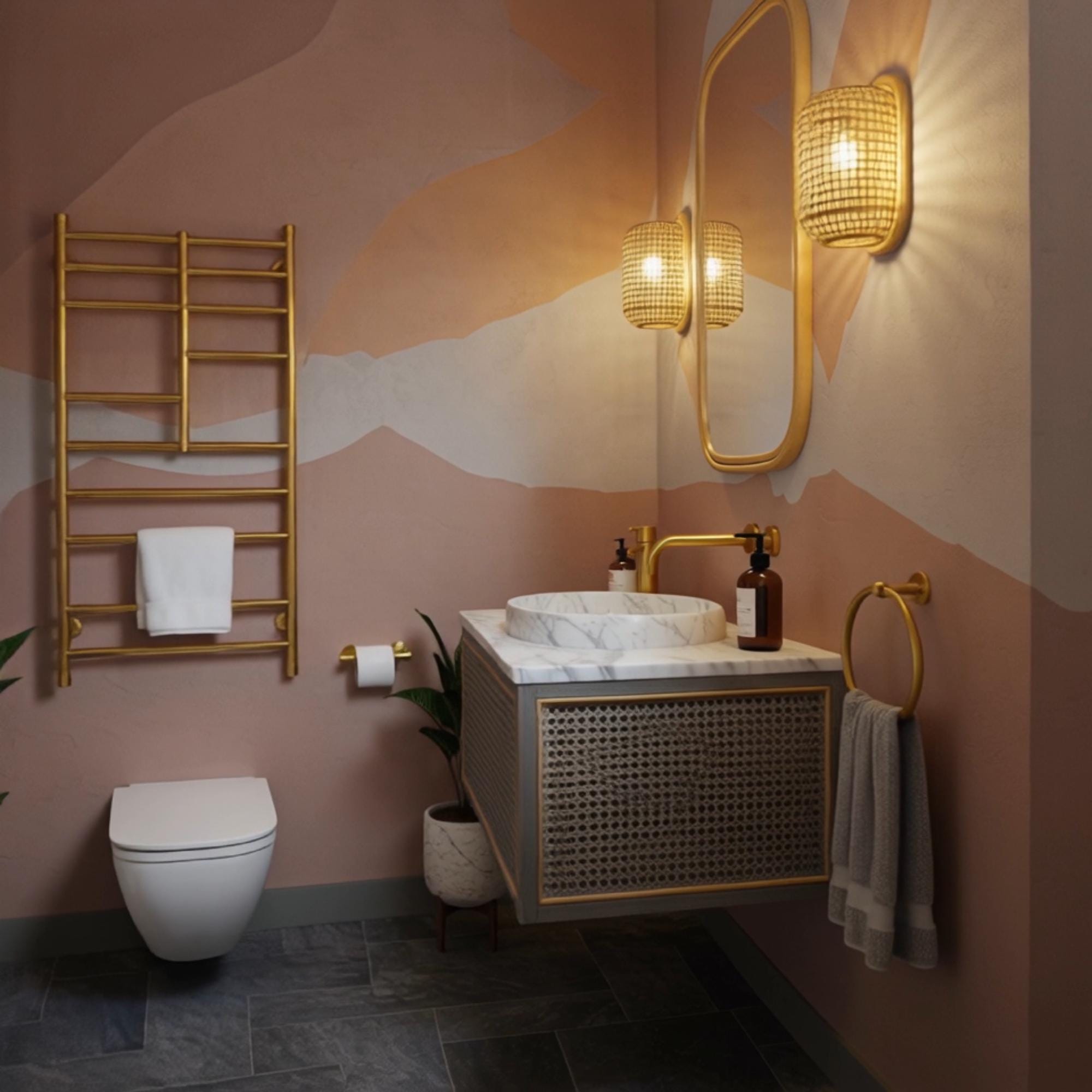 A floating Carrara marble sink with gold fixtures and rattan-inspired cabinet detailing adds a luxurious touch to modern spaces.